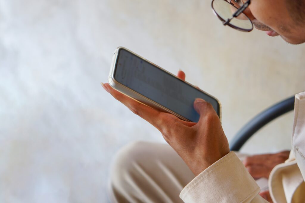 A person scrolling on a mobile phone.
